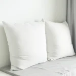 Oreiller blanc confortable en microfibre pour un sommeil réparateur.
